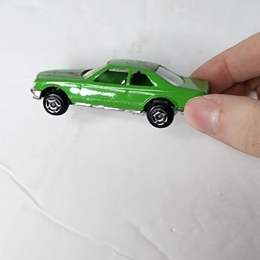 MERCEDES-BENZ 500 SEC  number 8803 can be found on inside Green Race Car #55